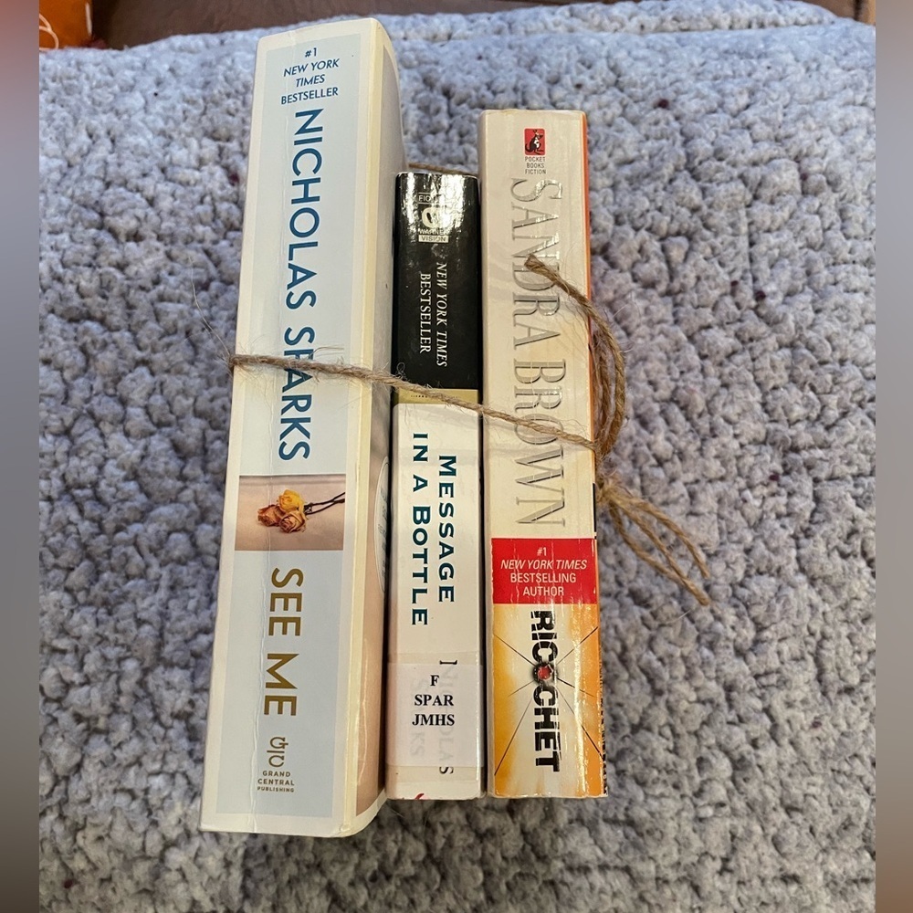 3) paper back books 2) Nicholas Sparks 1) Sandra Brown. Used